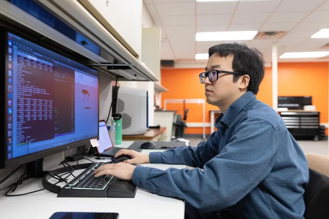 Student works at computer in lab.