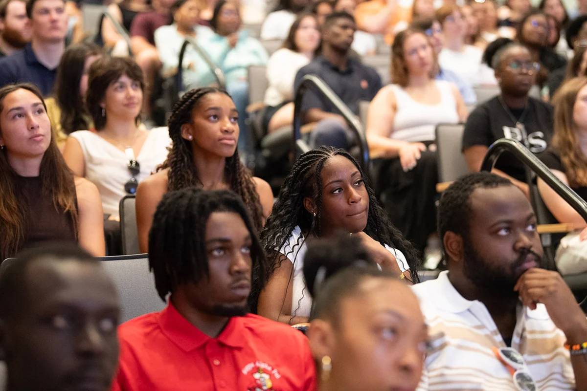 Students attending a seminar in an auditorium