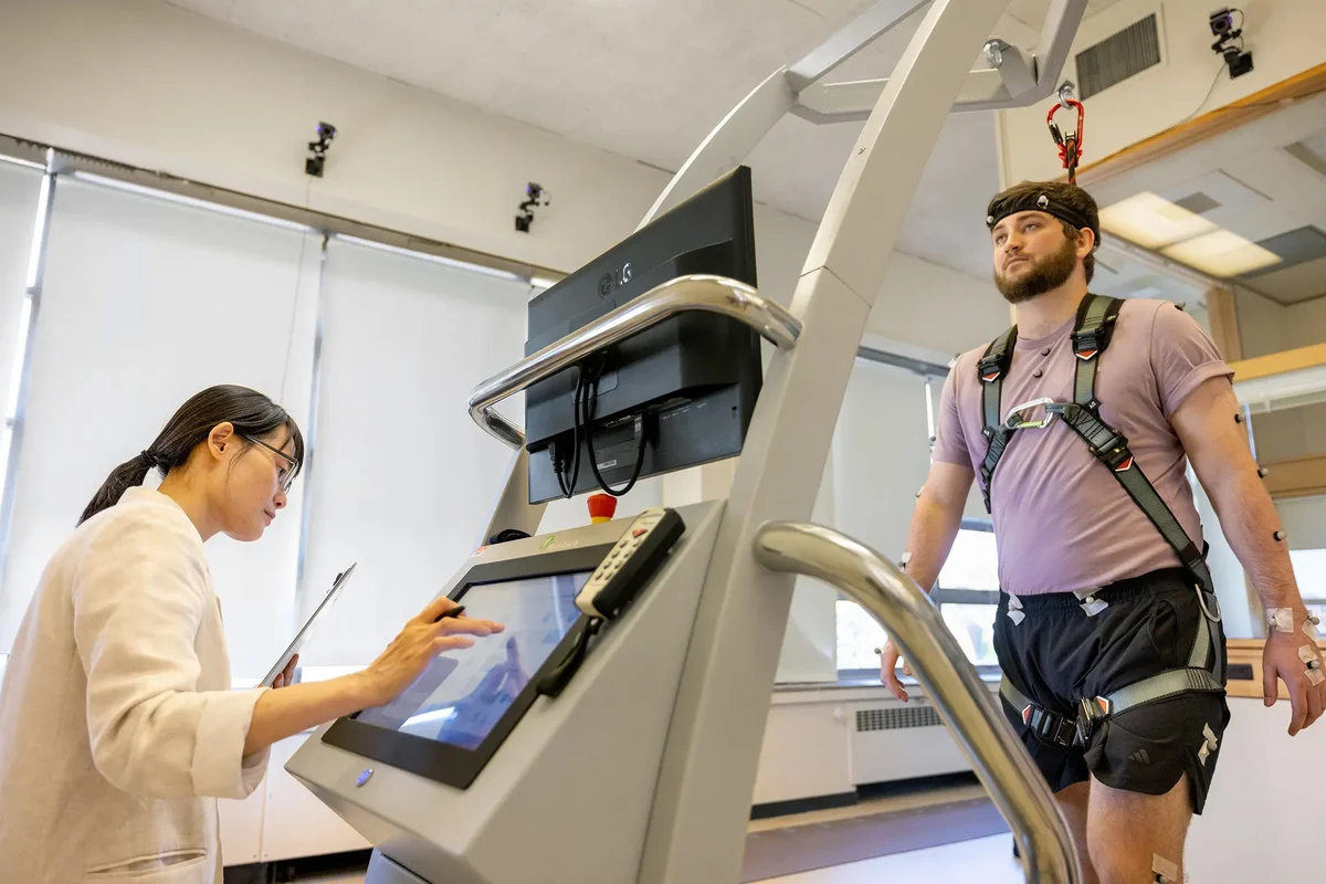 Students and professor in exercise science laboratory