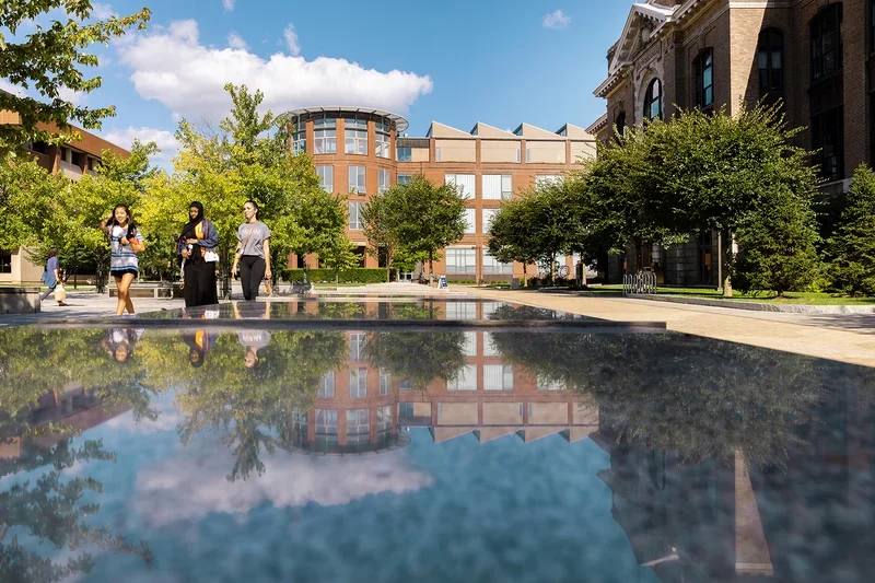 Campus looking through the reflection of a water feature.