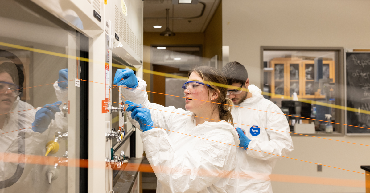 students working in an on-campus forensic science laboratory, evaluating mock ballistics evidence