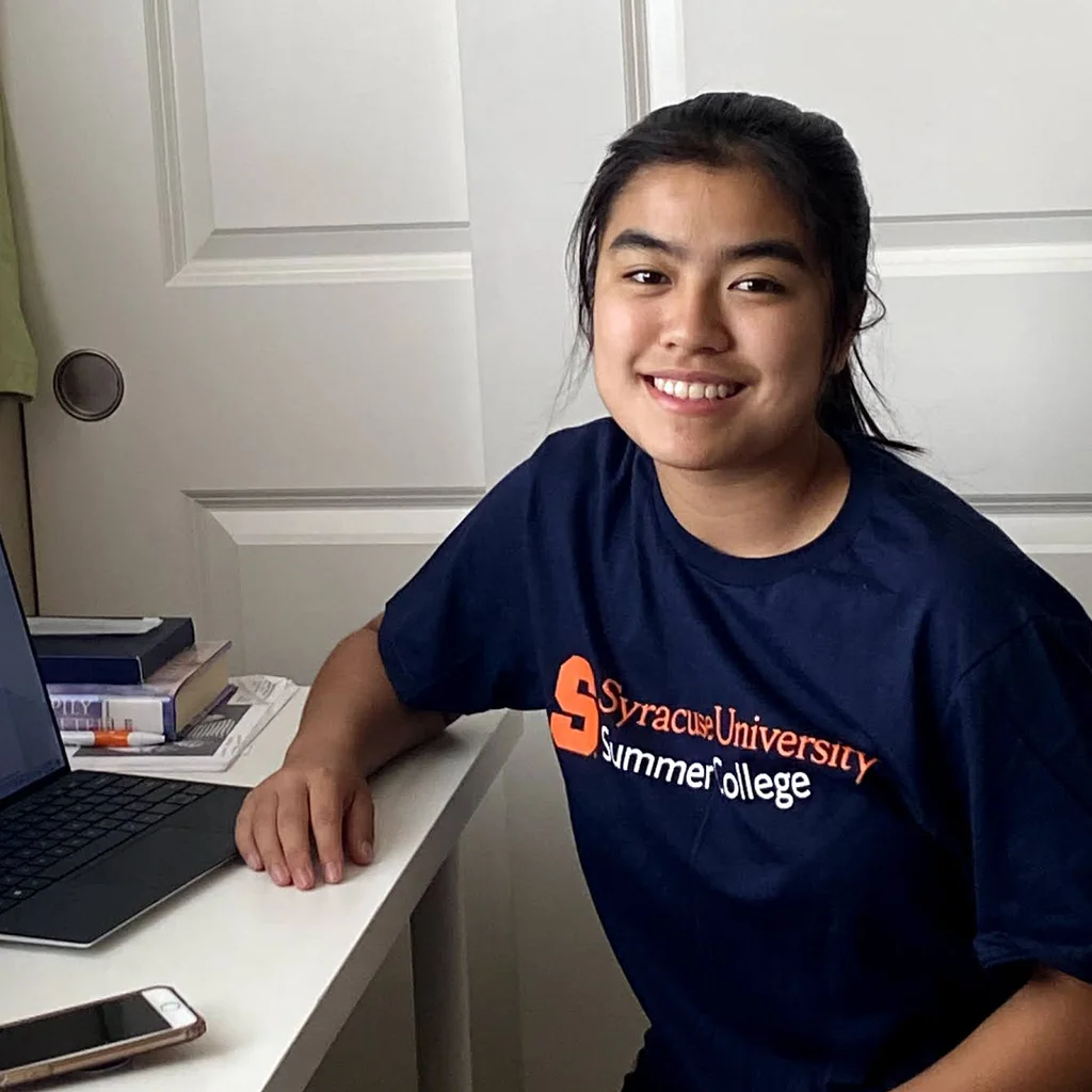 Summer College student at home on laptop