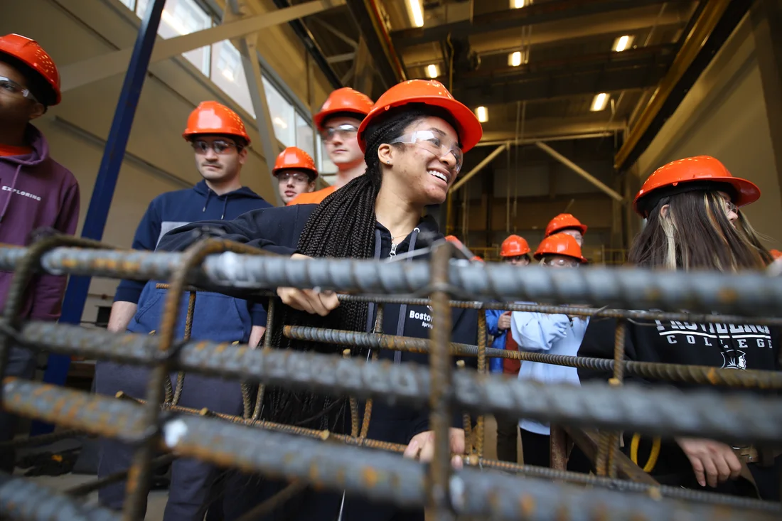 Civil engineering student wearing hardhats in a structures lab