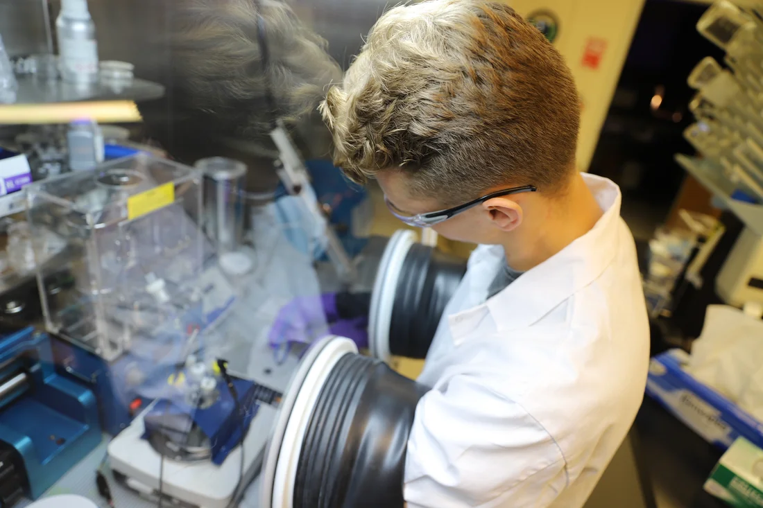 A chemical engineering student working in a lab