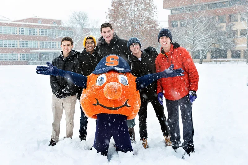 Otto and students together in the snow.